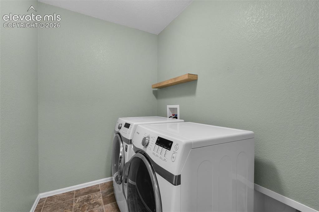 Image 36 of 41: Convenient main-level laundry room.