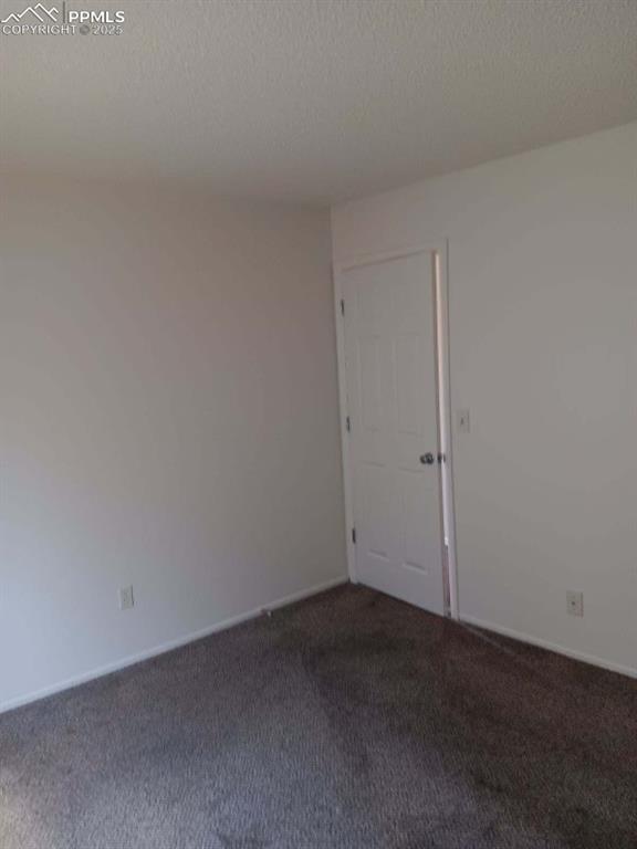 Image 4 of 19: Spare room featuring carpet and a textured ceiling