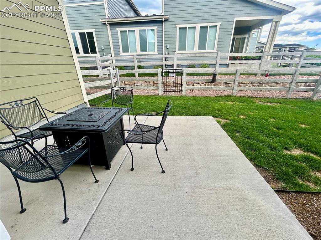 Image 23 of 30: Enjoy the shade in summer evenings on patio on the east side of the home.