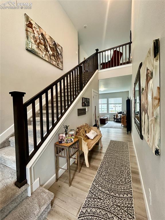 Image 3 of 30: The foyer boasts 2 story, soaring ceilings and opens to the loft,