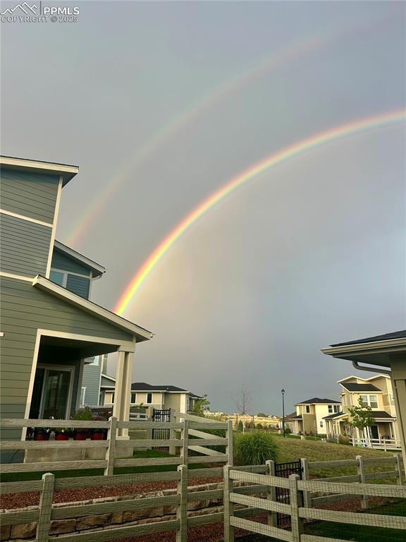 Image 30 of 30: Patio view of a double rainbow in August.