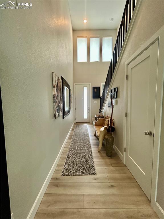 Image 4 of 30: Looking from the living room toward the entry door.