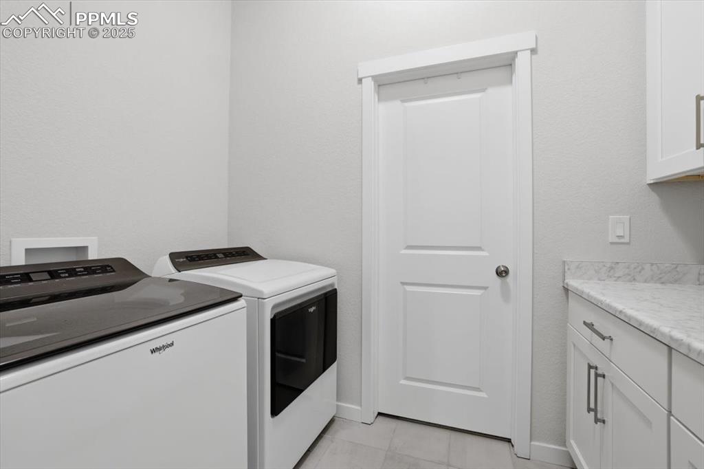 Image 22 of 43: Work space with storage and access to primary walk-in closet