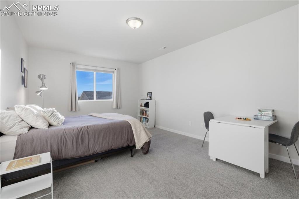 Image 32 of 43: Bedroom with carpet and baseboards