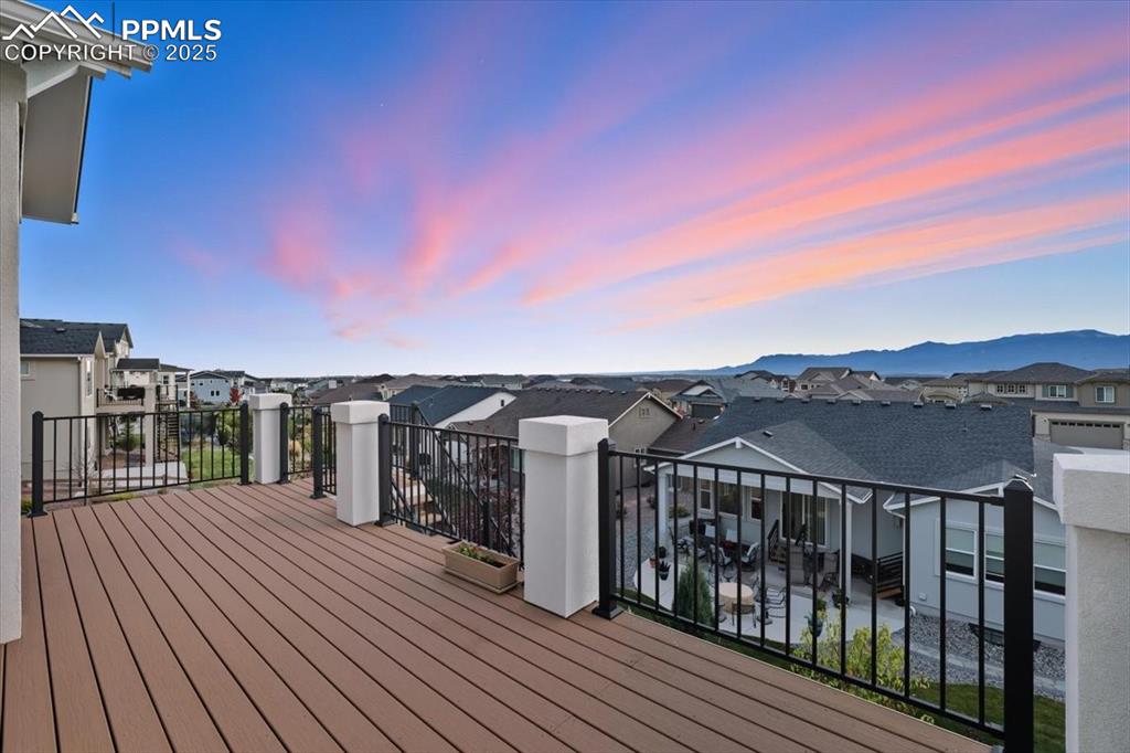 Image 5 of 43: Wooden terrace with a residential view