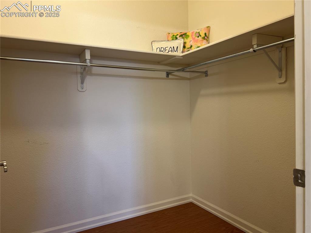 Image 18 of 30: Spacious closet featuring hardwood / wood-style flooring