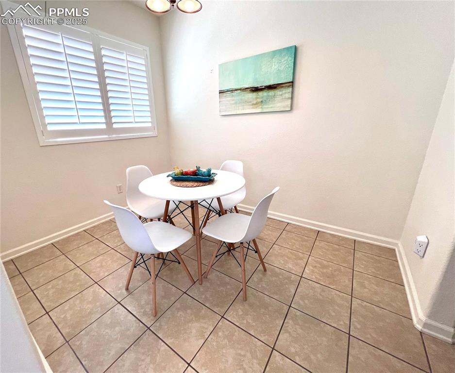 Image 24 of 30: Dining area with tile  flooring, nice office space or let your needs dictat