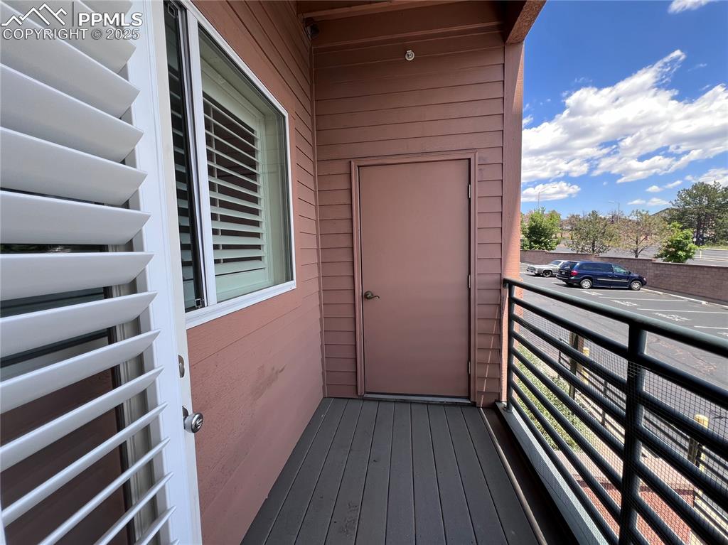 Image 26 of 30: View of balcony, and furnace closet, small extra storage