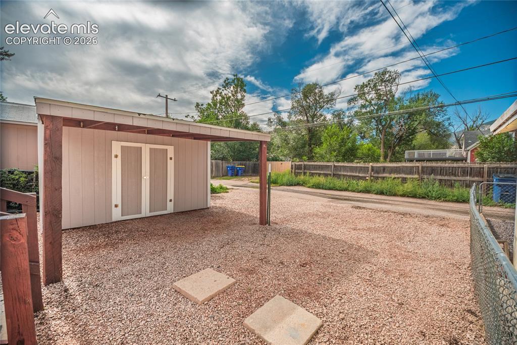 Image 24 of 27: Shed and carport