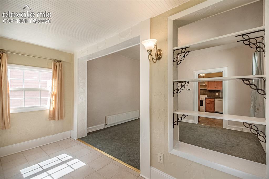 Image 4 of 27: Foyer and living room