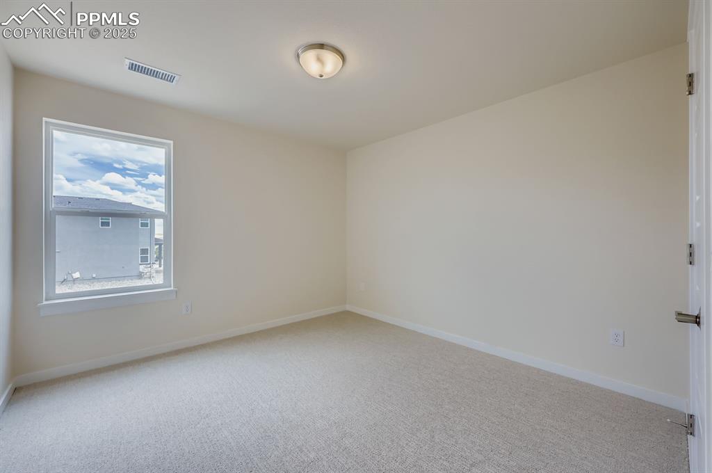 Image 18 of 28: Spare room with carpet flooring