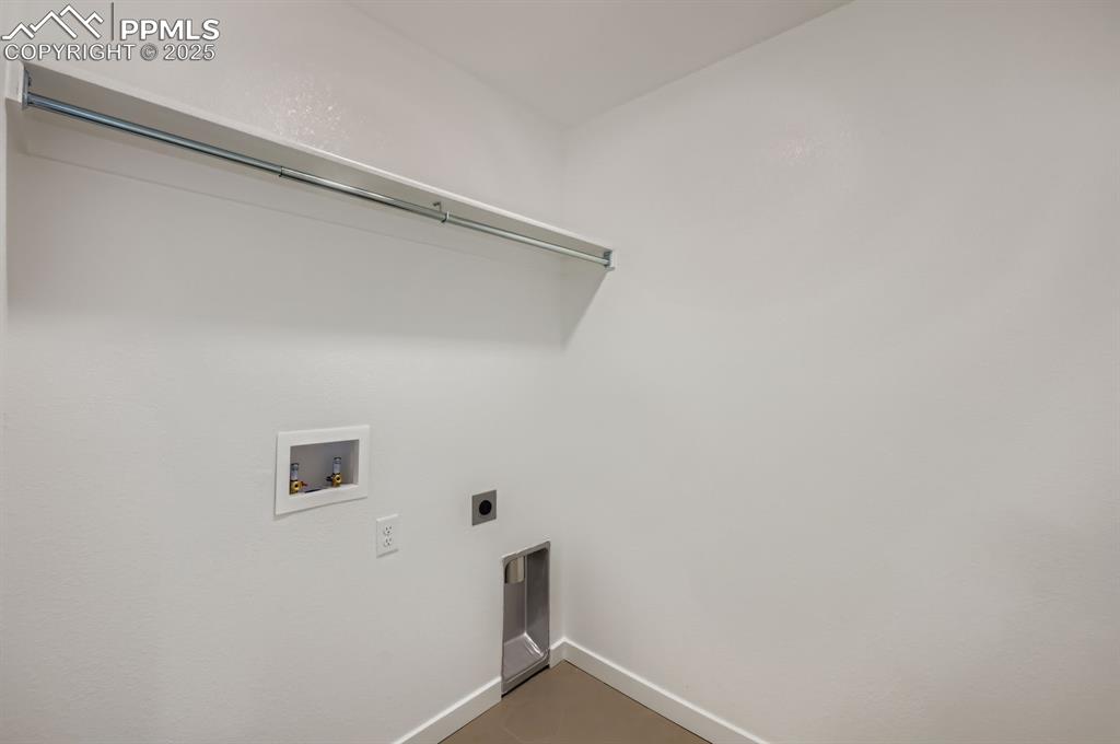 Image 26 of 28: Laundry area with hookup for a washing machine and hookup for an electric d