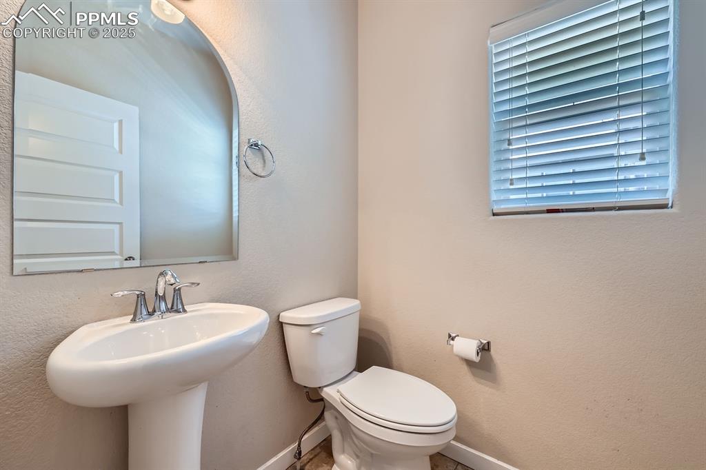 Image 12 of 27: Half bathroom featuring baseboards
