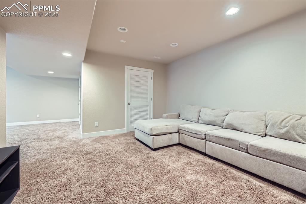 Image 23 of 27: Living area featuring carpet and recessed lighting