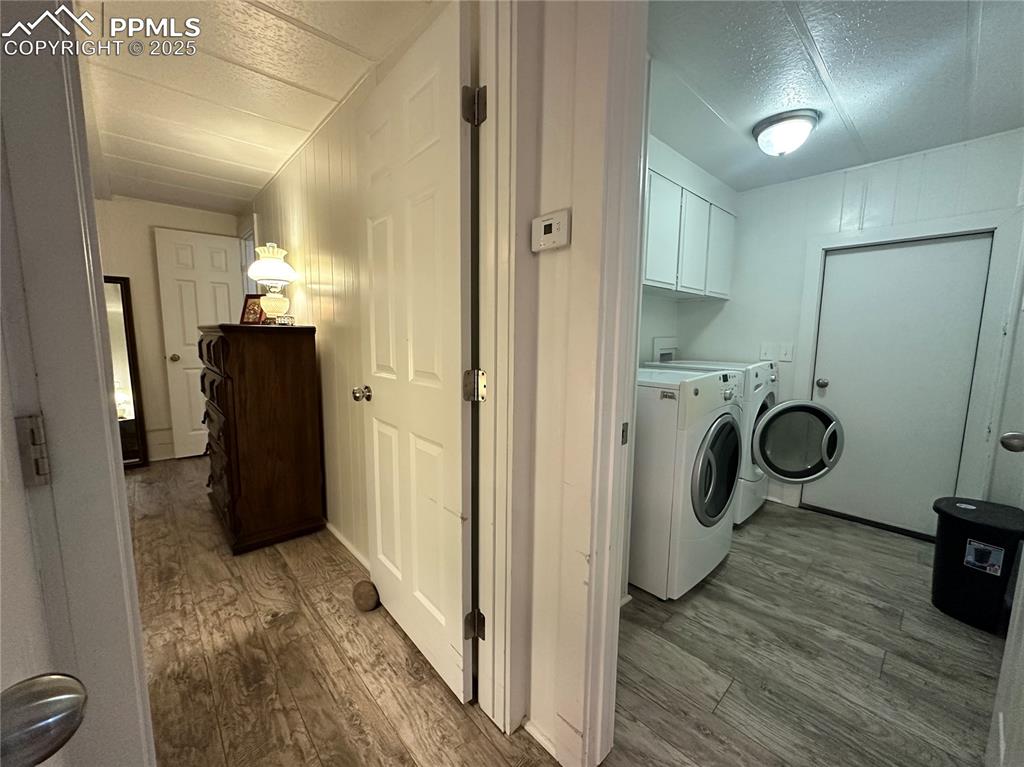 Image 11 of 36: Laundry room near kitchen and primary bedroom.
