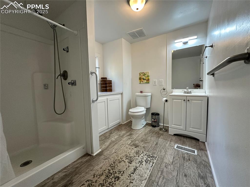 Image 15 of 36: 3/4 bath with vanity, a stall shower