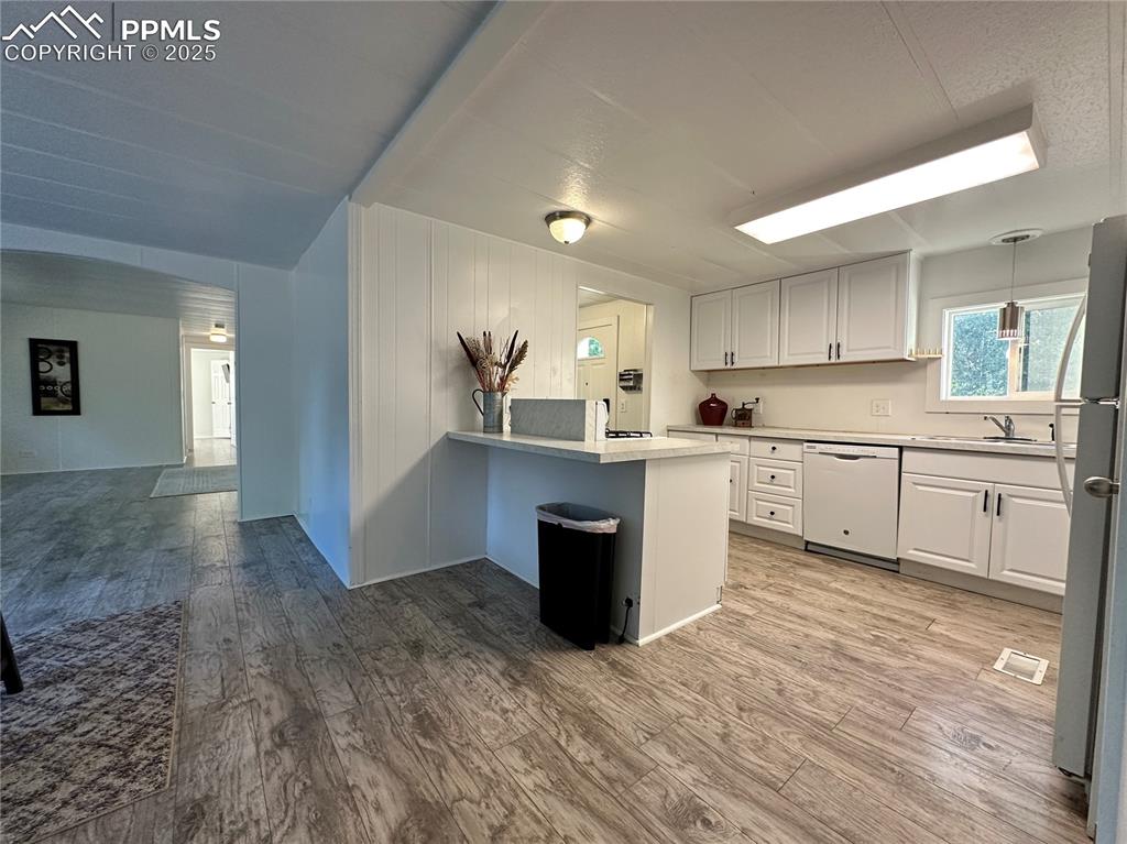 Image 9 of 36: Kitchen with view into the living room