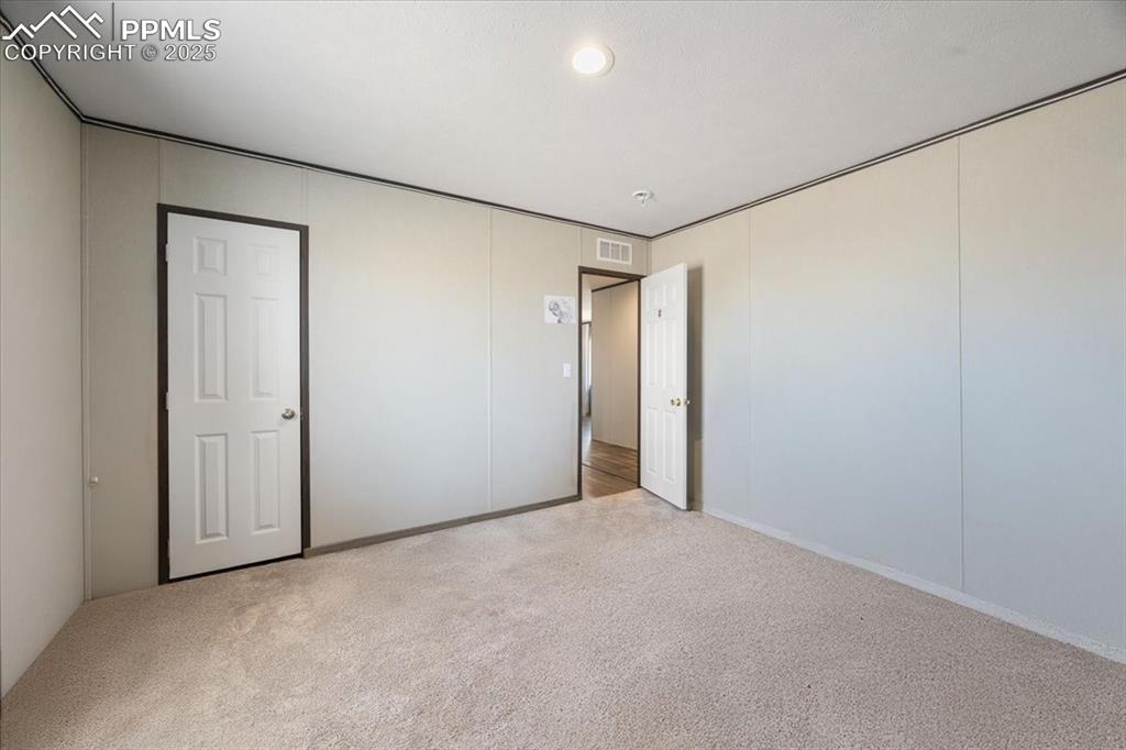 Image 27 of 40: Unfurnished bedroom featuring carpet flooring, recessed lighting, and a clo