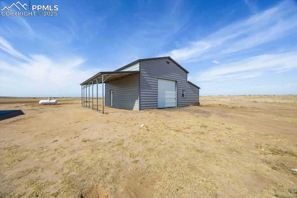 Image 30 of 40: View of outbuilding featuring a view of rural / pastoral area