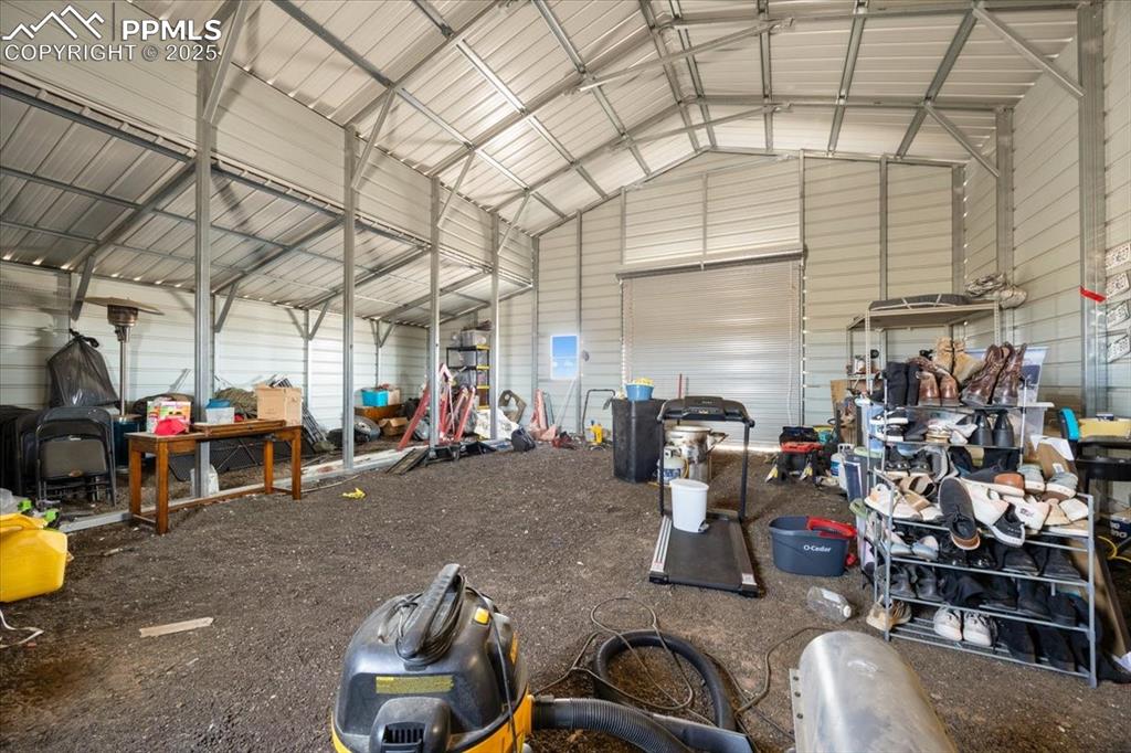 Image 32 of 40: Garage with metal wall