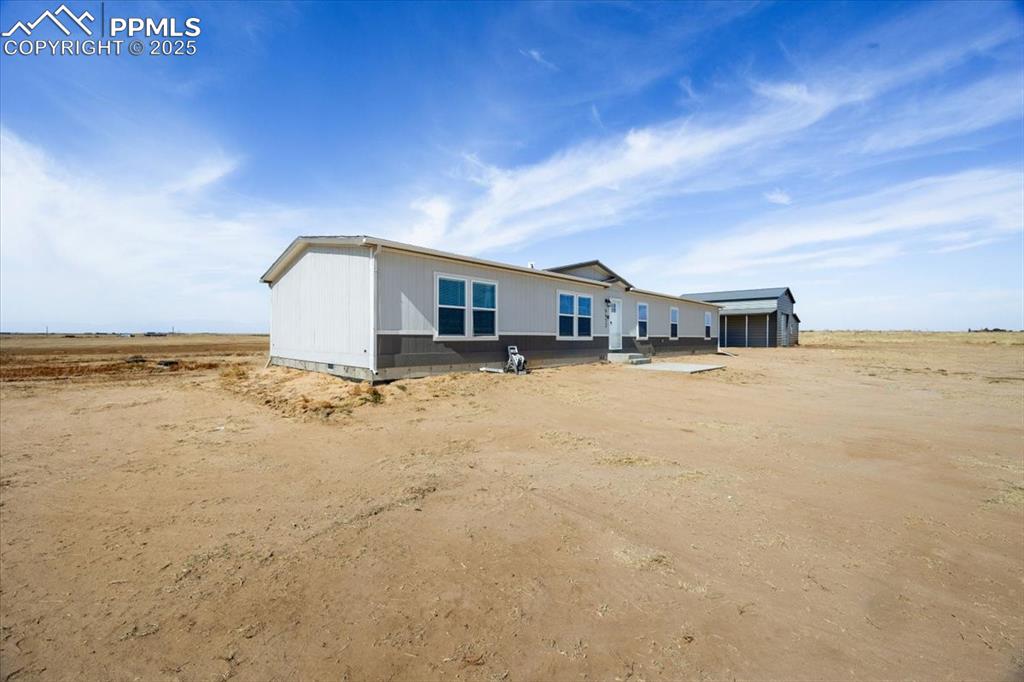 Image 37 of 40: Back of property featuring a patio