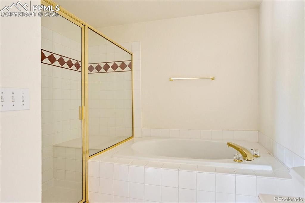 Image 16 of 27: Third Full Bathroom w/Tub Shower