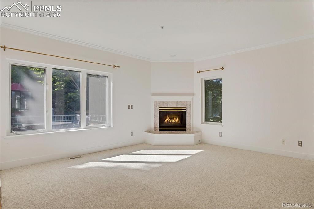 Image 18 of 27: Open Concept Living Room Cozy Fireplace