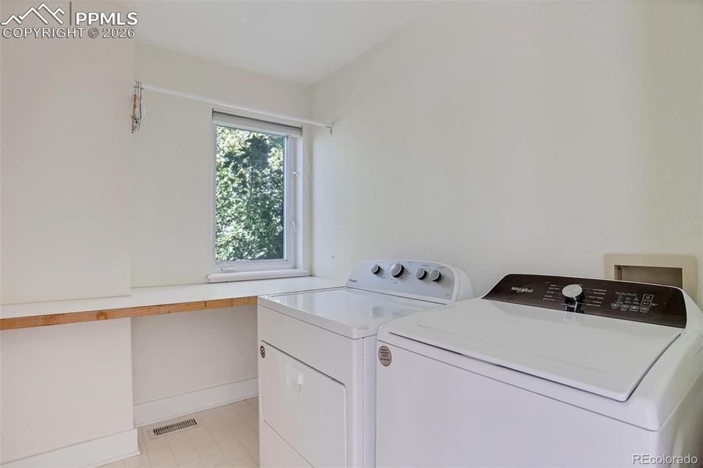 Image 26 of 27: Large Upstairs Laundry with Counter