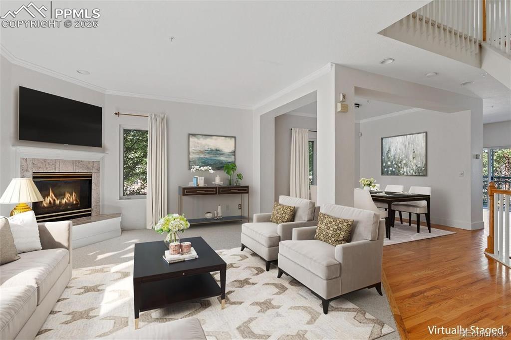 Image 5 of 27: Open Dining Living Area with Cozy Gas Fireplace