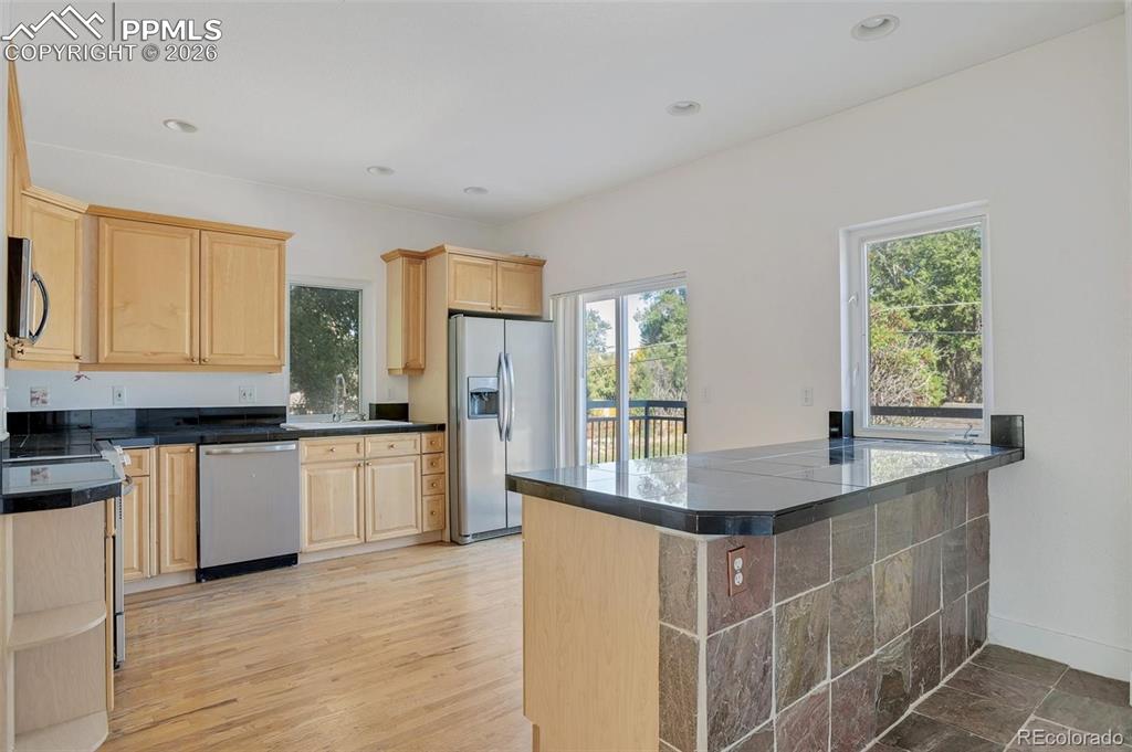 Image 8 of 27: Open Kichen with walk-out Balcony 