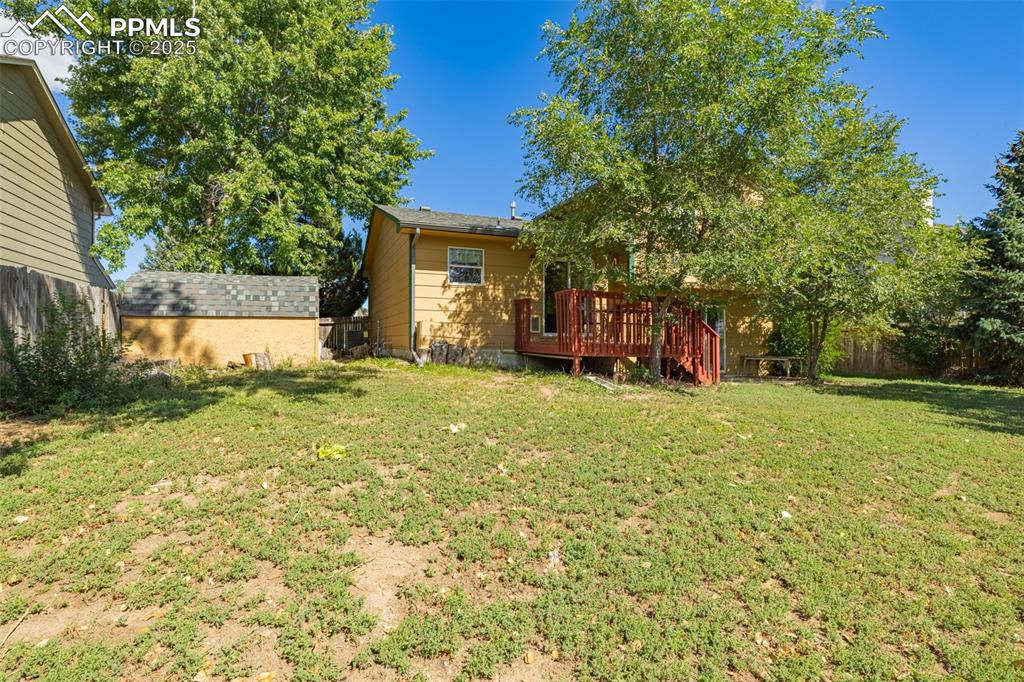 Image 22 of 37: View of yard with a wooden deck