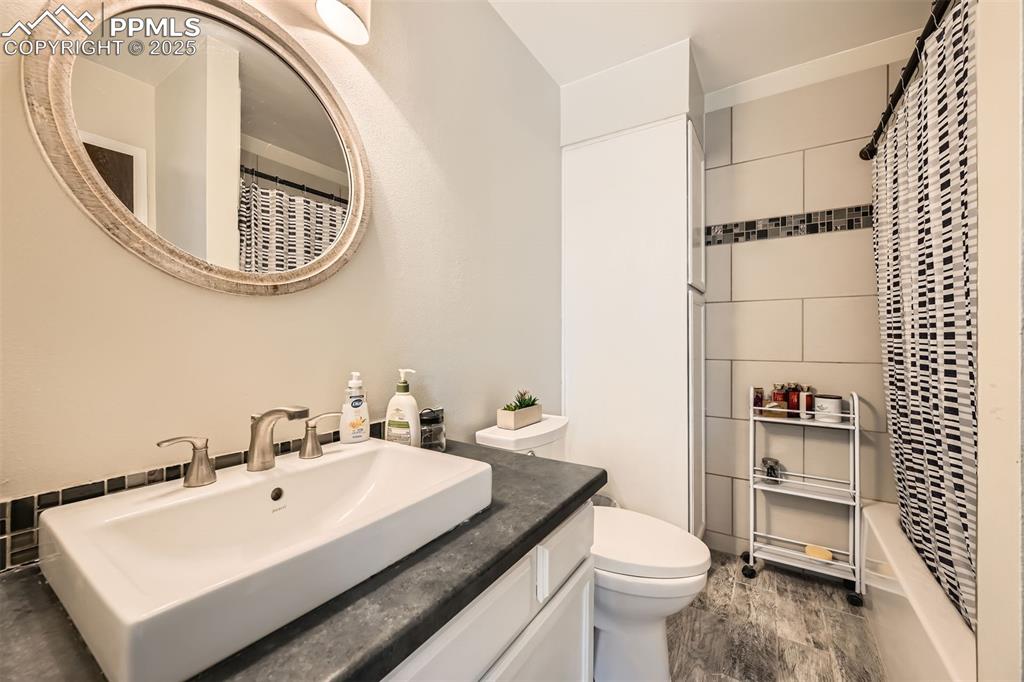 Image 16 of 29: Remodeled upper full bath