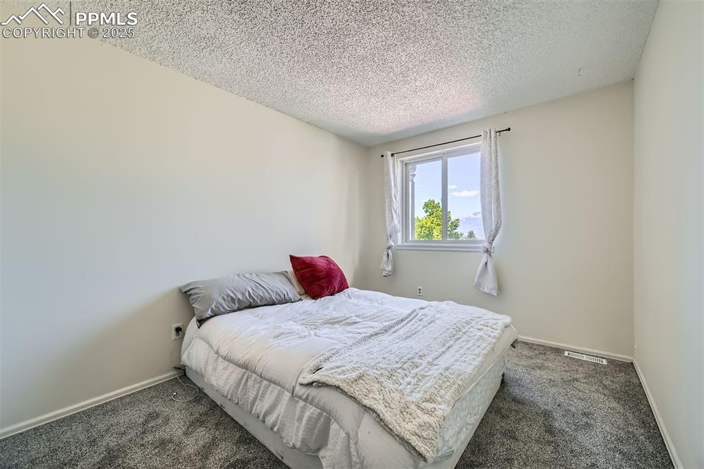Image 17 of 29: Secondary upper bedroom