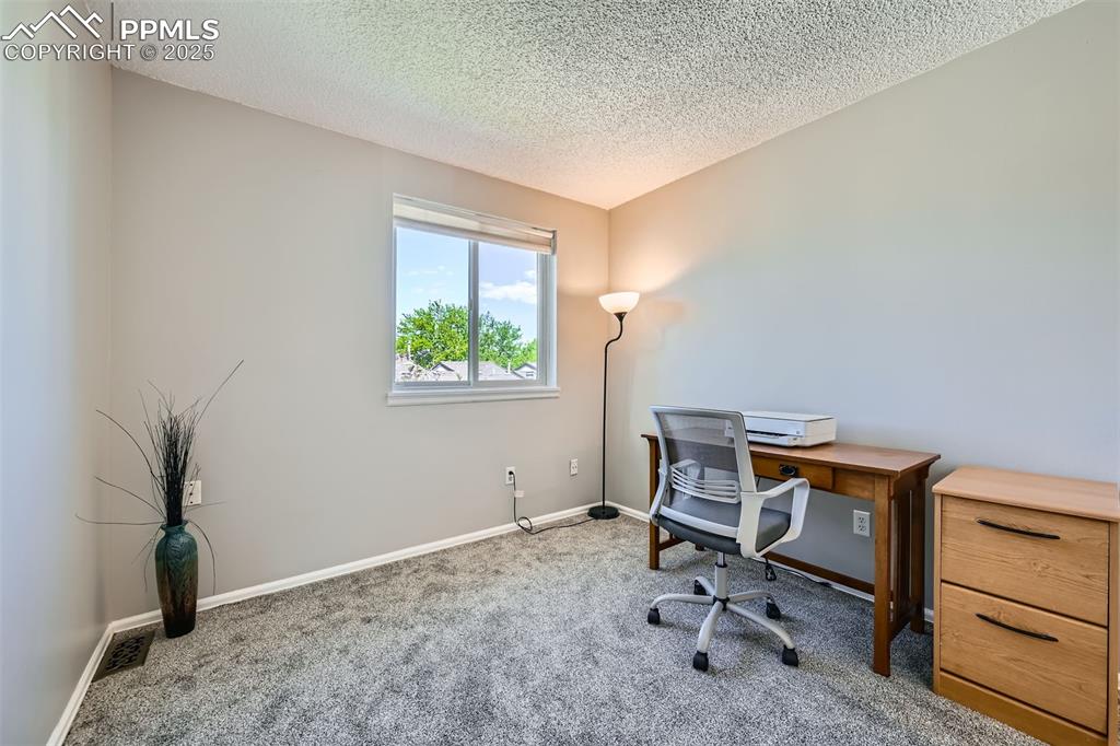 Image 19 of 29: Third living space or a perfect rom for an office