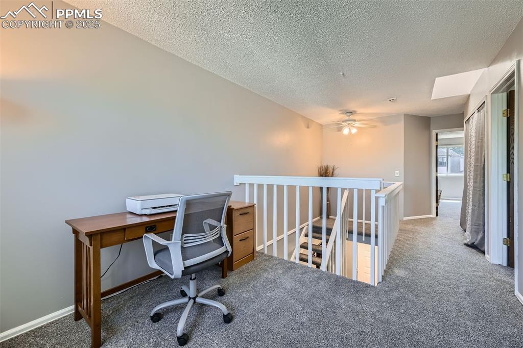 Image 20 of 29: Upper-level loft is a great flex space