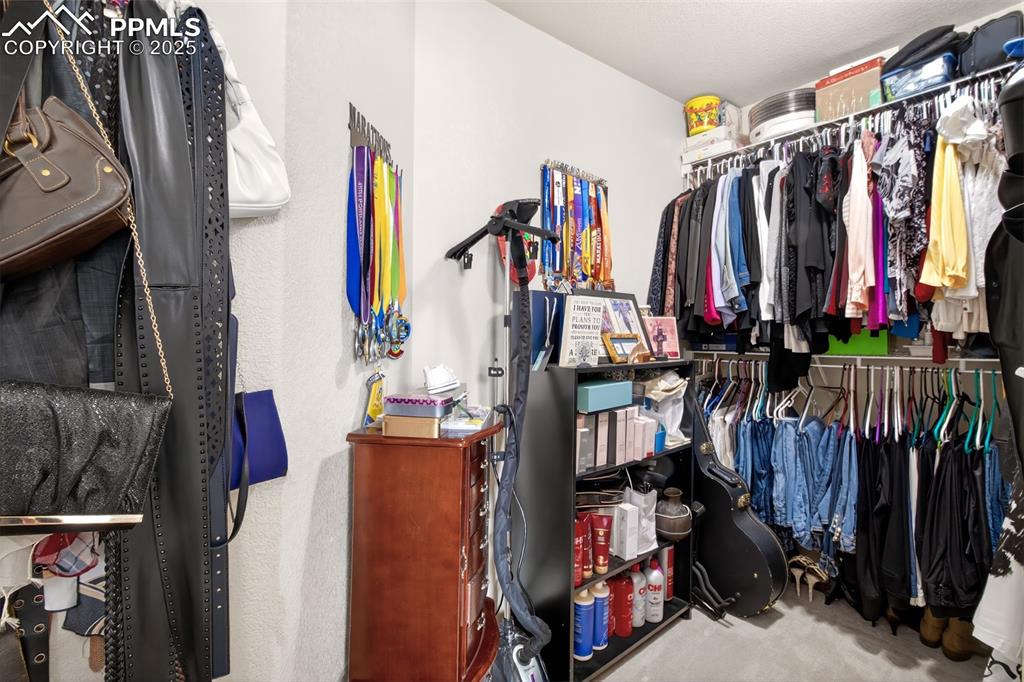 Image 20 of 38: Primary walk in closet