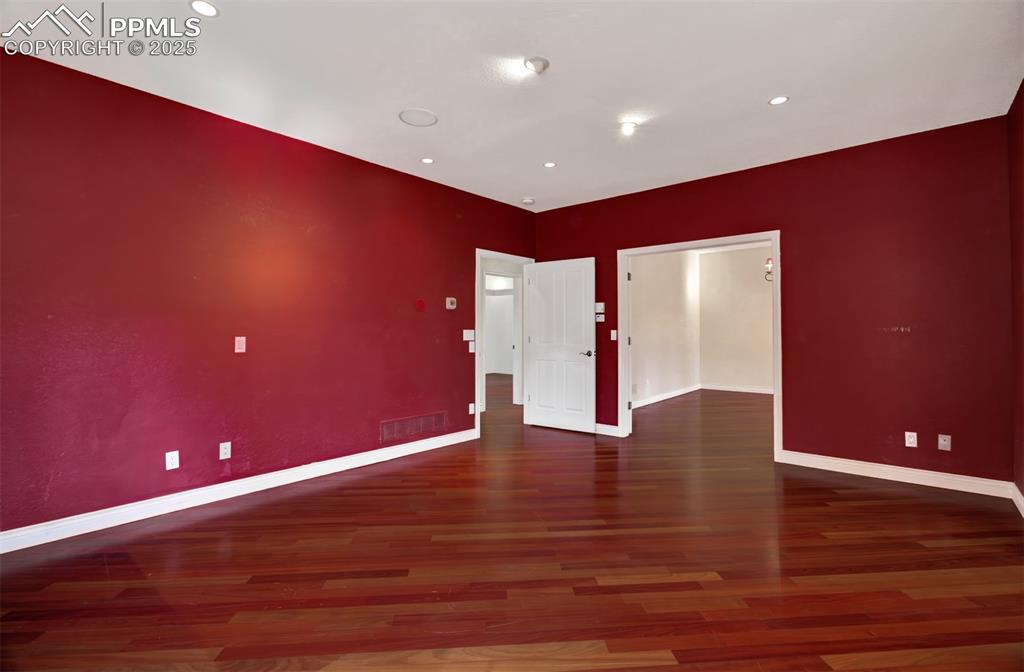 Image 12 of 48: Primary bedroom looking to bedroom 2
