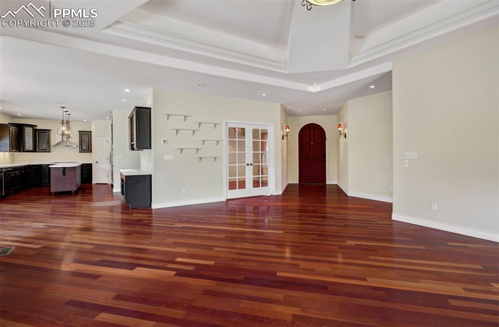 Image 4 of 48: Open concept living room looking into the dining room and kitchen