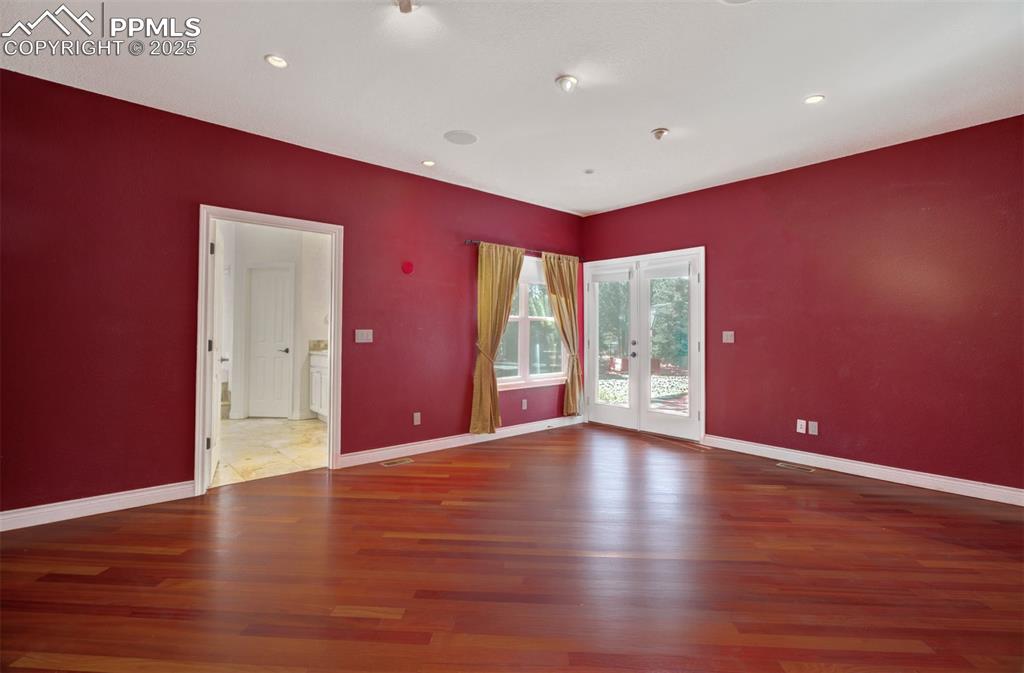 Image 9 of 48: Primary bedroom with an en suite 5 piece bathroom and the walk out to the s