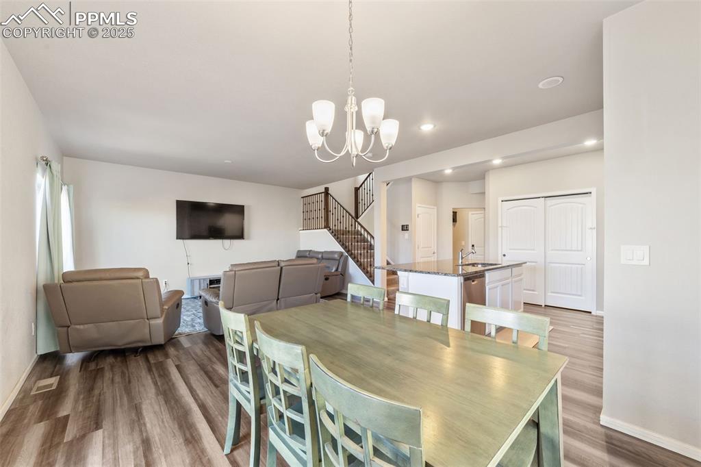 Image 5 of 23: Seamless flow between kitchen, dining, and living areas, ideal for gatherin