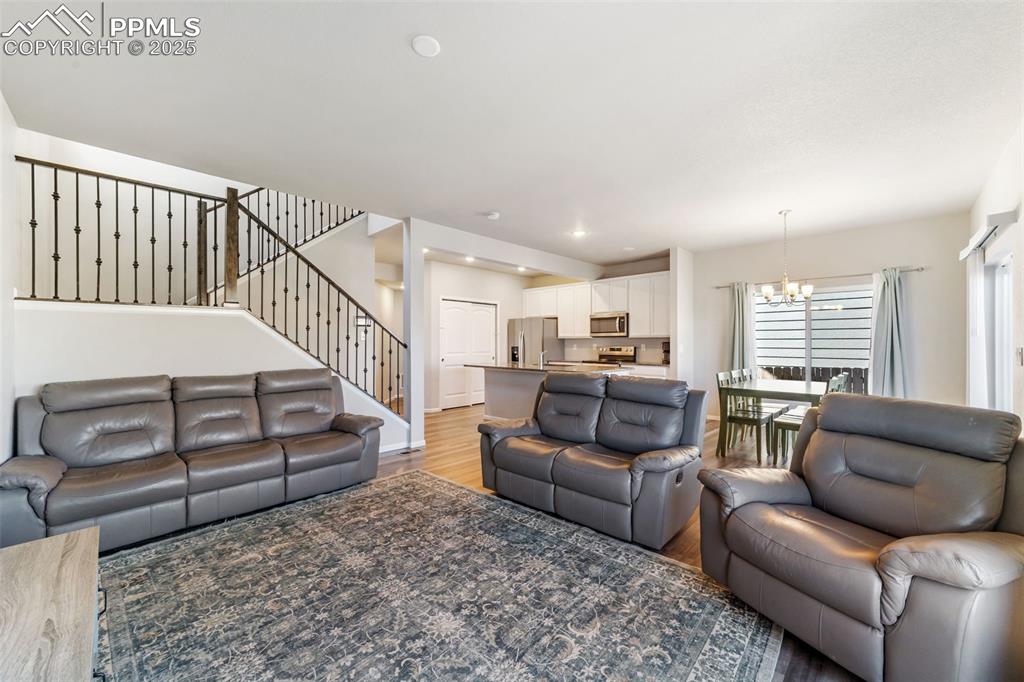 Image 6 of 23: Spacious great room with 9-foot ceilings, abundant natural light, and styli