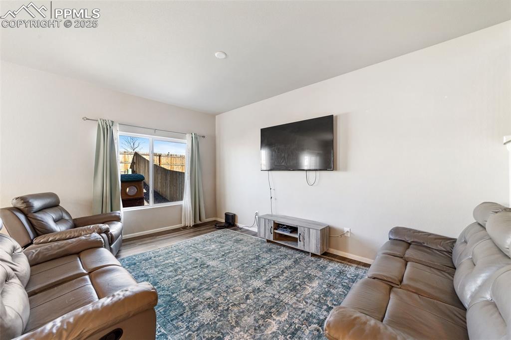 Image 7 of 23: Cozy and functional layout featuring lighted ceiling fan and open-concept d