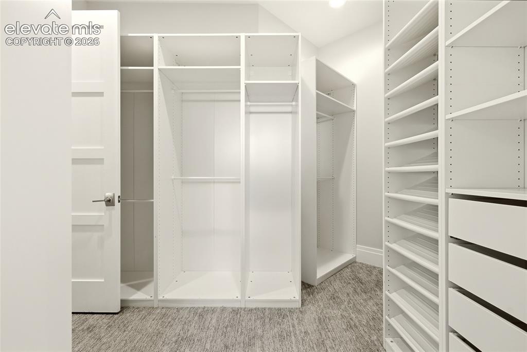 Image 19 of 50: Two Primary Closets