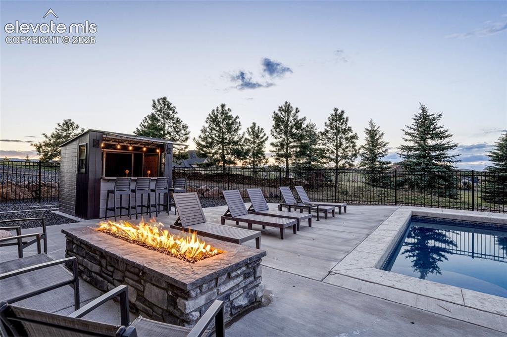 Image 20 of 50: Pool/firepit
