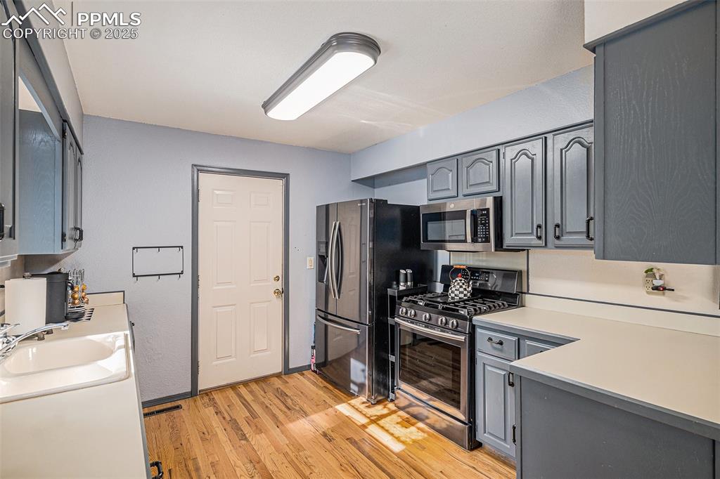 Image 2 of 20: Loads of Counter Space and Cabinets! Hardwood Floors! Stainless Steel Gas R