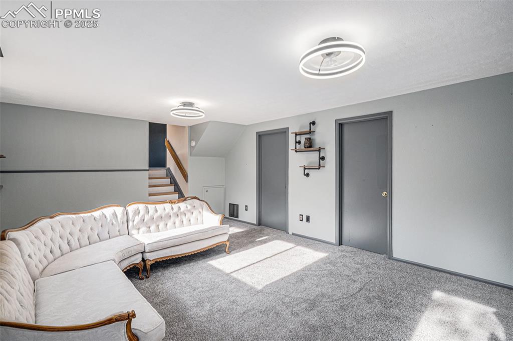 Image 6 of 20: Lower Level Family Room with Lots of Natural light!