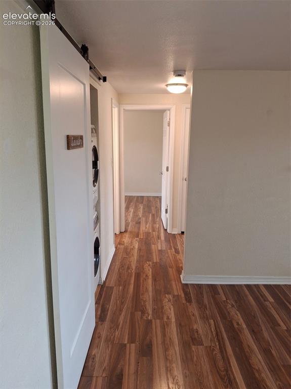 Image 5 of 10: Wood-finish flooring extending through the hallway