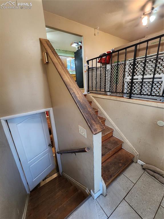 Image 19 of 33: Stairs featuring baseboards