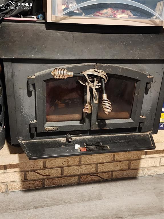 Image 23 of 33: Wood burning fireplace insert