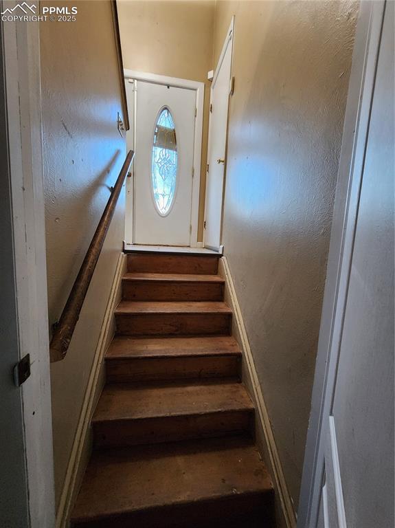 Image 28 of 33: Staircase to downstairs